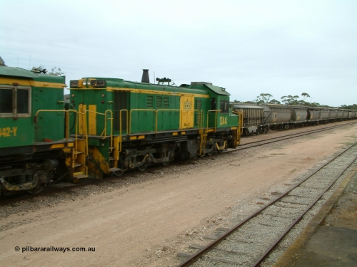 030407 114344
Poochera, empty grain train arrives behind former Australian National locomotive rebuilt from former AE Goodwin ALCo model DL531 830 class ex 839 serial 83730 by Port Augusta Workshops to DA class unit DA 4 to shunt off empty waggons and pick up the loaded ones. 7th April 2003.
Keywords: DA-class;DA4;83730;Port-Augusta-WS;ALCo;DL531G/1;830-class;839;rebuild;