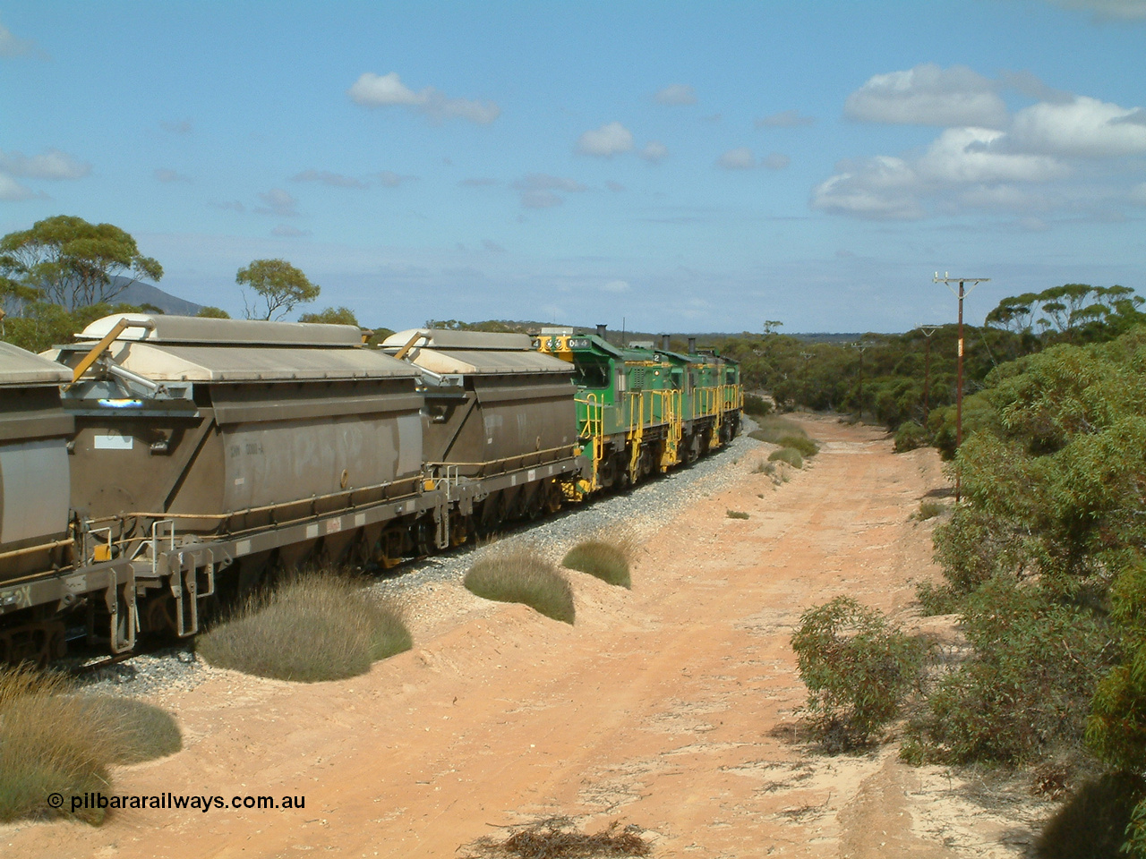 030409 110628
Caralue, loaded grain train working south of the former station site 830 class unit 851 AE Goodwin ALCo model DL531 serial 84137, 851 has spent its entire operating career on the Eyre Peninsula, it leads fellow 830 class 842 serial 84140 and a rebuilt unit DA 4, rebuilt from 830 class unit 839 by Port Augusta Workshops, retains original serial 83730 and model DL531.
Keywords: DA-class;DA4;83730;Port-Augusta-WS;ALCo;DL531G/1;830-class;839;rebuild;