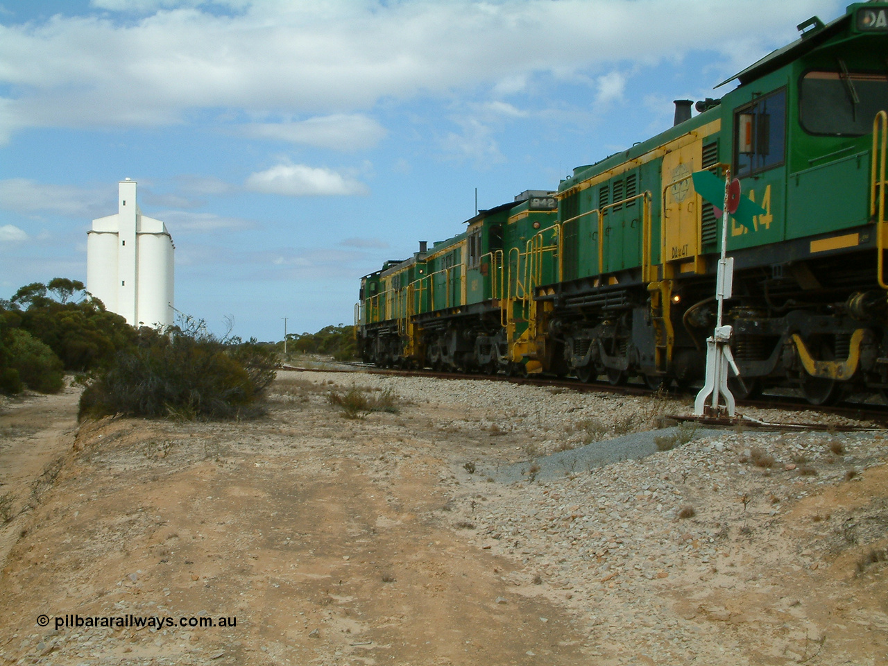 030409 122744
Kielpa, loaded grain train with 830 class unit 851 AE Goodwin ALCo model DL531 serial 84137, 851 has spent its entire operating career on the Eyre Peninsula, leads fellow 830 class 842 serial 84140 and a rebuilt unit DA 4 rumbles over the north end points heading south.
