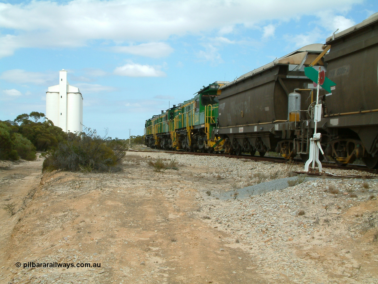 030409 122746
Kielpa, loaded grain train with 830 class unit 851 AE Goodwin ALCo model DL531 serial 84137, 851 has spent its entire operating career on the Eyre Peninsula, leads fellow 830 class 842 serial 84140 and a rebuilt unit DA 4 rumbles over the north end points heading south.
