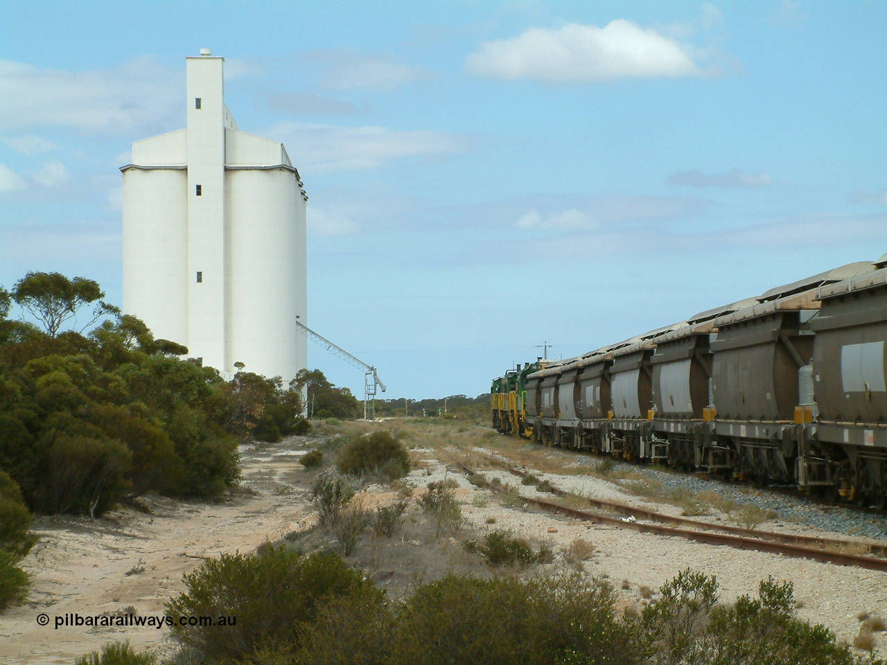 030409 122808
Kielpa, loaded grain train with 830 class unit 851 AE Goodwin ALCo model DL531 serial 84137, 851 has spent its entire operating career on the Eyre Peninsula, leads fellow 830 class 842 serial 84140 and a rebuilt unit DA 4 rumbles over the north end points heading south.
