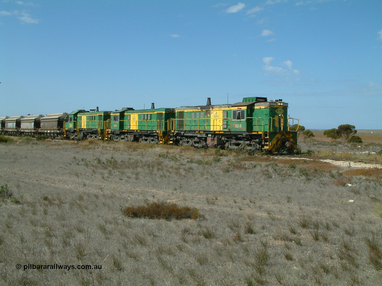 030409 140546
Wharminda, loaded grain train arrives behind 830 class unit 851 AE Goodwin ALCo model DL531 serial 84137, 851 has spent its entire operating career on the Eyre Peninsula, with fellow 830 class 842 serial 84140 and a rebuilt unit DA 4 as they stop to pick up loaded waggons.
Keywords: 830-class;851;84137;AE-Goodwin;ALCo;DL531;
