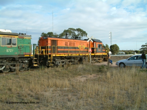 030409 080120
Warramboo, empty grain train stopped for a crew change. Rebuild unit DA 7 in Australian Southern orange and black livery shows its original heritage body style of an NSWGR 48 class 4813 AE Goodwin ALCo model DL531 serial 83713, rebuilt by Islington Workshops SA with long hood and parts from former 830 class 870 AE Goodwin ALCo model DL531 serial G6016-06 in 1998.
Keywords: DA-class;DA7;83713;Port-Augusta-WS;ALCo;DL531G/1;48-class;4813;rebuild;