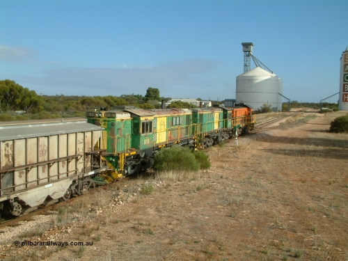 030409 084542
Kyancutta, empty grain train runs through the yard behind rebuild DA class unit DA 7 in Australian Southern orange and black livery leading a pair of AE Goodwin built ALCo model DL531 830 class units 872 and 871 with a string of grain waggons.
Keywords: 830-class;871;AE-Goodwin;ALCo;DL531;G3422-1;