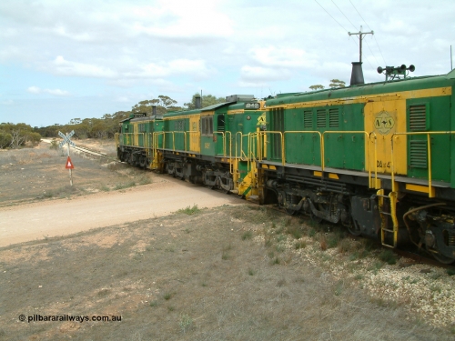 030409 115614
Darke Peake, at the 195 km Dog Fence Road grade crossing loaded grain train with 830 class unit 851 AE Goodwin ALCo model DL531 serial 84137, 851 has spent its entire operating career on the Eyre Peninsula, leads fellow 830 class 842 serial 84140 and a rebuilt unit DA 4, rebuilt from 830 class unit 839 by Port Augusta Workshops, retains original serial 83730 and model DL531 with the first twelve waggons behind the locos XNW type.
Keywords: 830-class;842;AE-Goodwin;ALCo;DL531;84140;