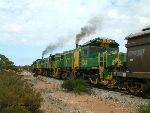 030409 121224
Kielpa, a few kilometres south of the former Konanda siding loaded grain train with 830 class unit 851 AE Goodwin ALCo model DL531 serial 84137, 851 has spent its entire operating career on the Eyre Peninsula, leads fellow 830 class 842 serial 84140 and a rebuilt unit DA 4, rebuilt from 830 class unit 839 by Port Augusta Workshops, retains original serial 83730 and model DL531 with the first twelve waggons behind the locos XNW type powers away from a crew change.
Keywords: DA-class;DA4;83730;Port-Augusta-WS;ALCo;DL531G/1;830-class;839;rebuild;