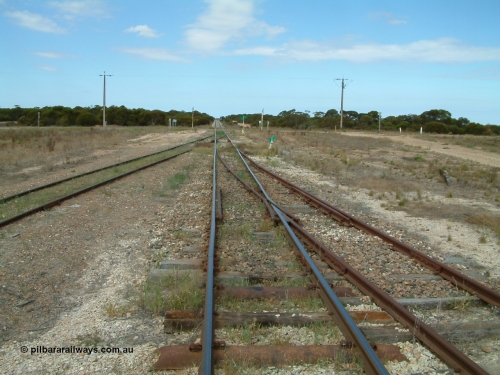 030409 125102
Rudall, view looking south from the south end, the goods and grain loop coming in from the left with the stub siding (former station loop) on the right.
