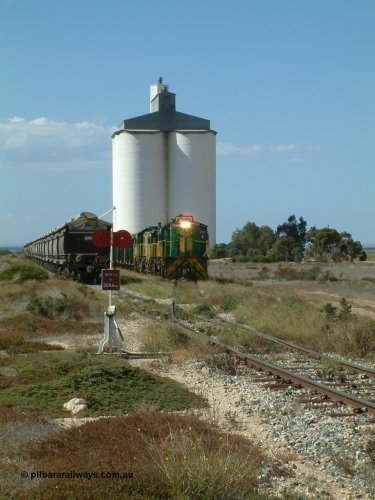 030409 141326
Wharminda, the engines 830 class unit 851 AE Goodwin ALCo model DL531 serial 84137, fellow 830 class 842 serial 84140 and a rebuilt unit DA 4 shunt back out of the siding for the mainline with the loaded waggons.
Keywords: 830-class;851;AE-Goodwin;ALCo;DL531;84137;
