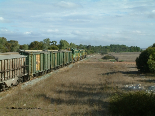 030409 152437
Ungarra, the peace is shattered as a loaded grain train storms upgrade through the station behind 830 class unit 851 AE Goodwin ALCo model DL531 serial 84137, fellow 830 class 842 serial 84140 and a rebuilt DA class unit DA 4 trailing view with the ENHV waggons as the continue south.
Keywords: ENHV-type;Societe-Gregg-de-Europ;NVD-type;ENBA-type;