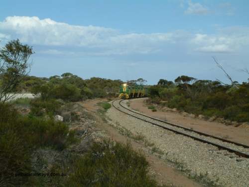 030409 153916
Moody Tank, a loaded grain train storms around the curve behind 830 class unit 851 AE Goodwin ALCo model DL531 serial 84137, fellow 830 class 842 serial 84140 and a rebuilt DA class unit DA 4.
Keywords: 830-class;851;AE-Goodwin;ALCo;DL531;84137;