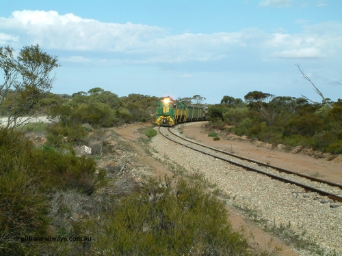 030409 153922
Moody Tank, a loaded grain train storms around the curve behind 830 class unit 851 AE Goodwin ALCo model DL531 serial 84137, fellow 830 class 842 serial 84140 and a rebuilt DA class unit DA 4.
Keywords: 830-class;851;AE-Goodwin;ALCo;DL531;84137;