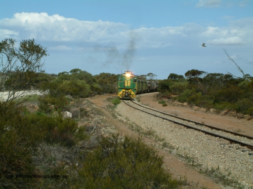 030409 153926
Moody Tank, a loaded grain train storms around the curve behind 830 class unit 851 AE Goodwin ALCo model DL531 serial 84137, fellow 830 class 842 serial 84140 and a rebuilt DA class unit DA 4.
Keywords: 830-class;851;AE-Goodwin;ALCo;DL531;84137;