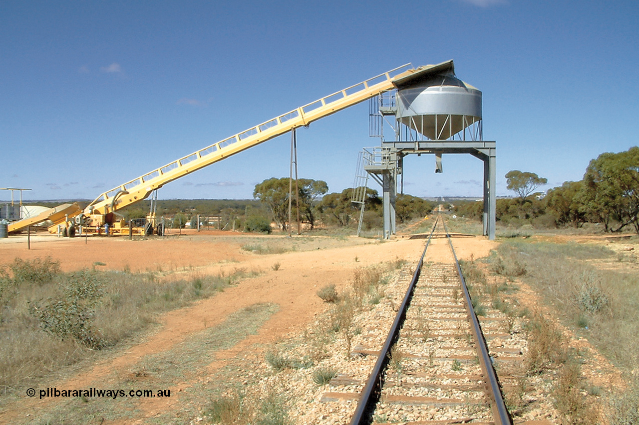 030411 105103
Kimba Grain Bunker site, overhead mainline loading bin, looking south towards Kimba, augers from the storage area on the left.
