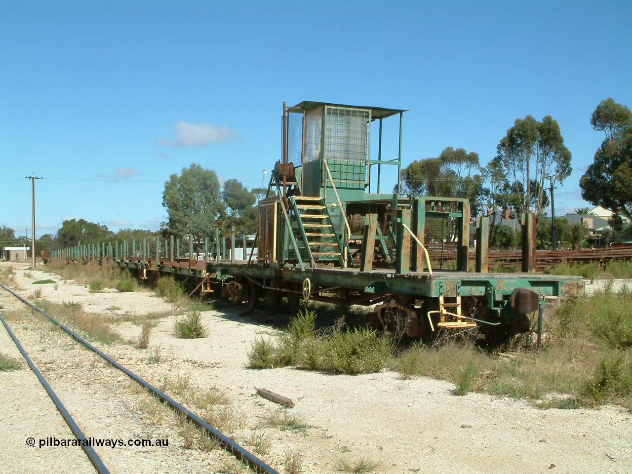 030411 105938
Kimba, rail recovery waggon set with winch waggon EZWL 2, eight ENFR type and one ENFB type waggons. The cabin is mounted above the motor, built using underframe of broad gauge horse box BH 4331. To Eyre Peninsula 1992, re-coded then from AZWL. Scrapped in 2005.
Keywords: EZWL-type;EZWL2;SAR-Islington-WS;BH-type;BH4331;