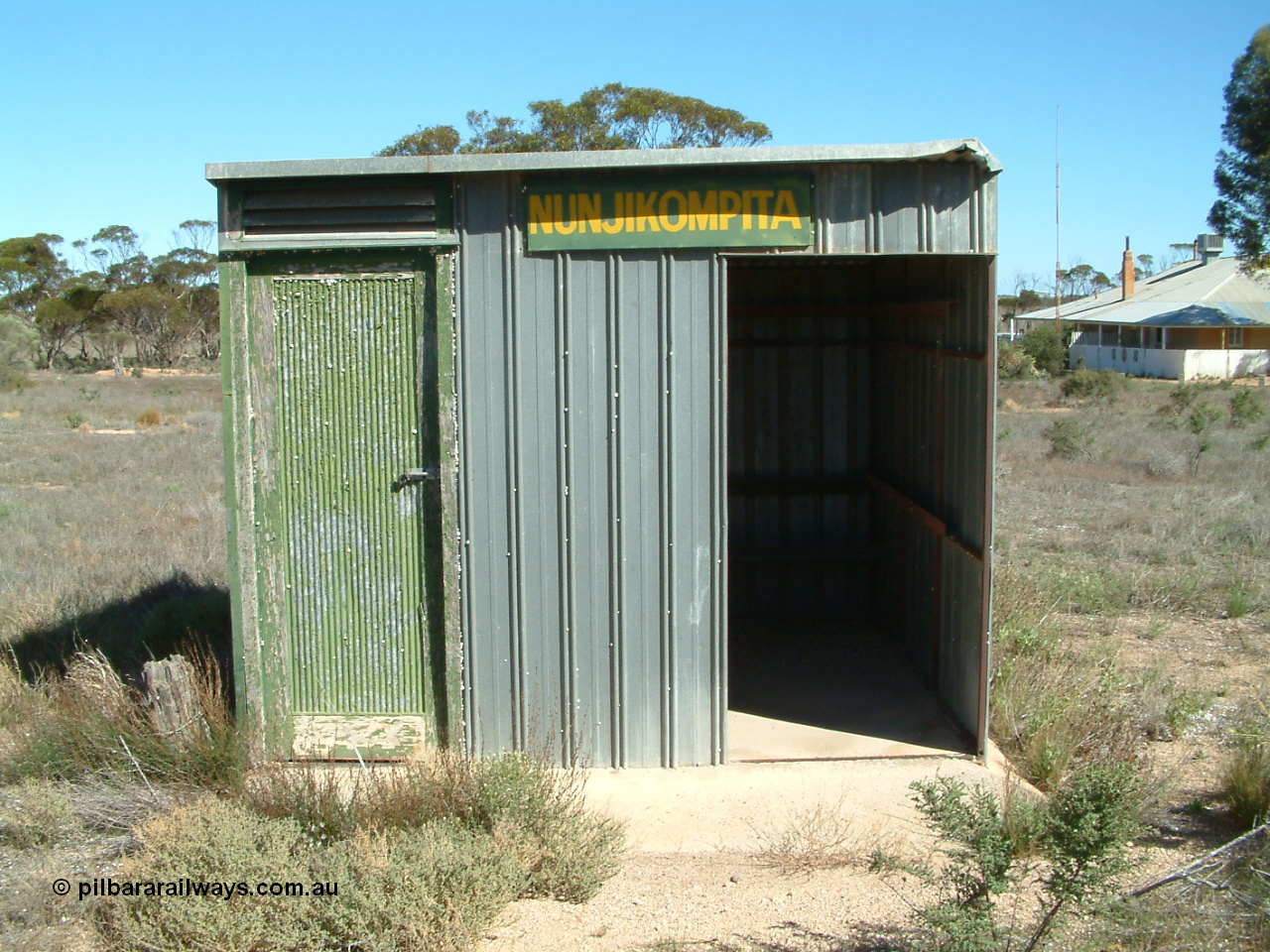 030411 141404
Nunjikompita, front view of 'station' shelter shed, the door on the left used to house the control telephone.
