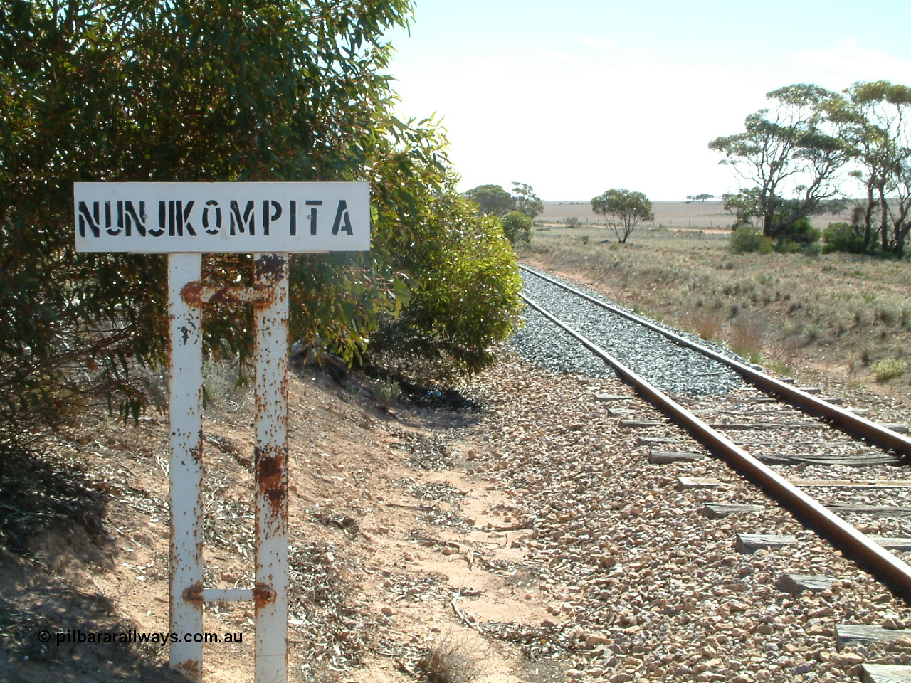 030411 142235
Nunjikompita, yard or station location sign, located about a kilometre out from the actual location. Fresh ballast is on the line.
