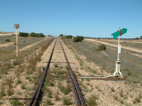 030411 141801
Nunjikompita, looking east from the east end of the yard, W whistle or horn post for grade crossing of Nunyah Road in the distance.
