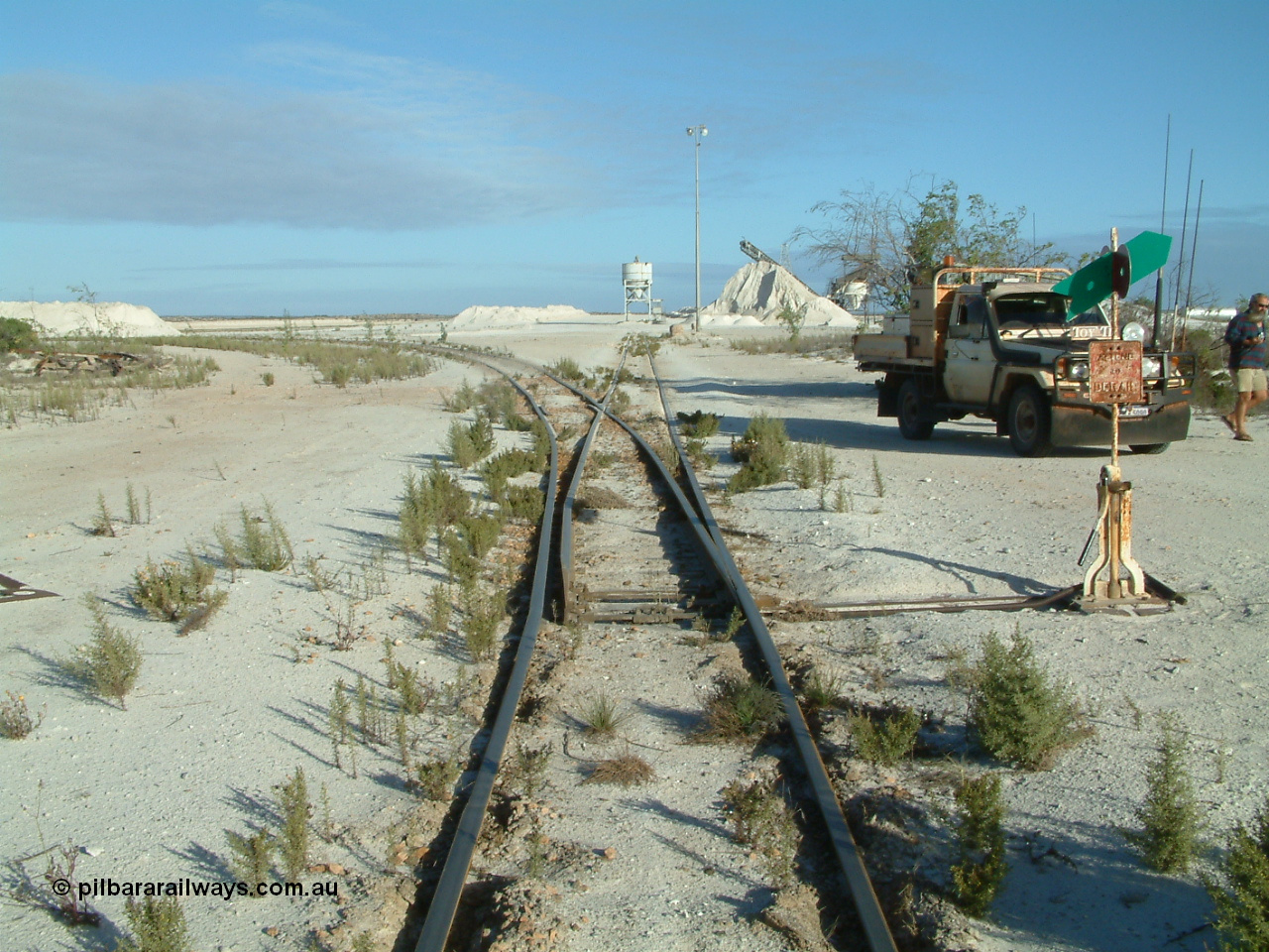 030414 163800
Kevin, , the points for the mainline to Penong Junction (Ceduna) with that line curving away to the left, straight ahead is the former gypsum loading bins.
