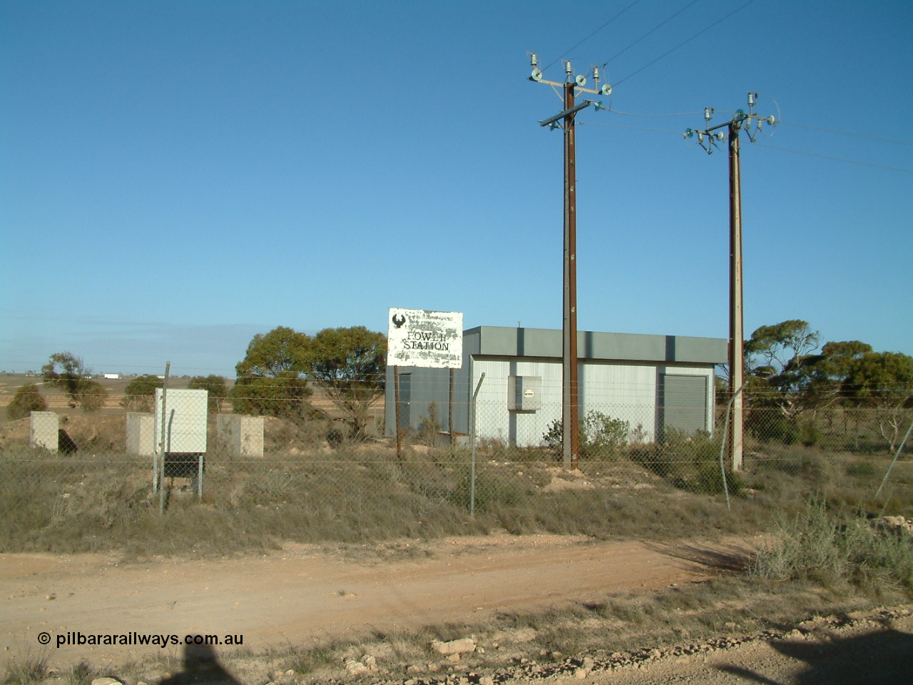 030414 165816
Penong, former power station, couple of Stobie poles out the front.
