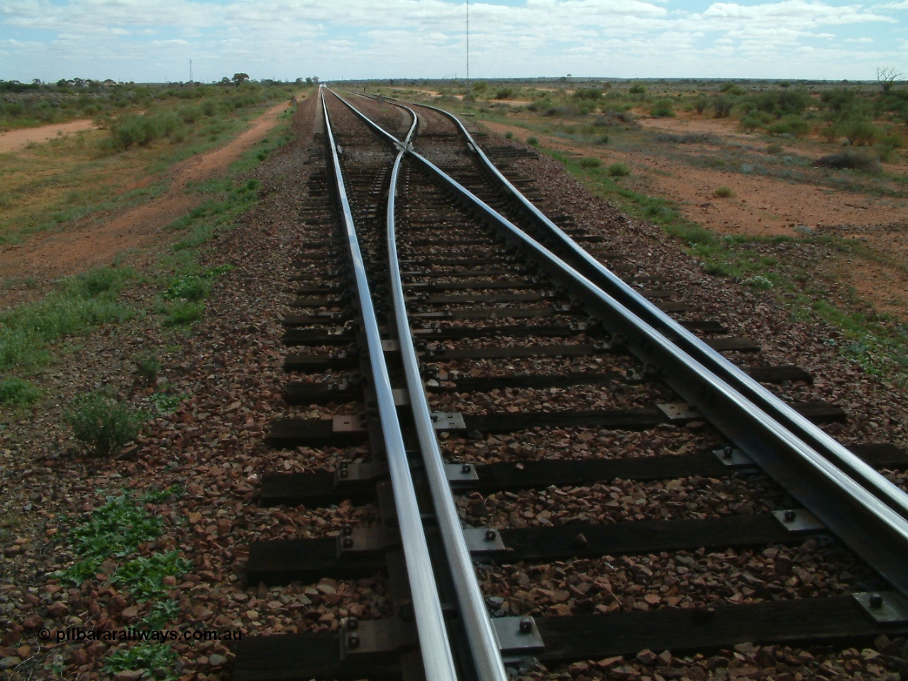 030415 135552
Kingoonya, located at the 426.5 km on the Trans Australian Railway, looking west at the timber section that carries the points or turnout and the concrete sleepers can be seen starting again. [url=https://goo.gl/maps/7TMcikXj33EqWvyCA]GeoData location[/url].
