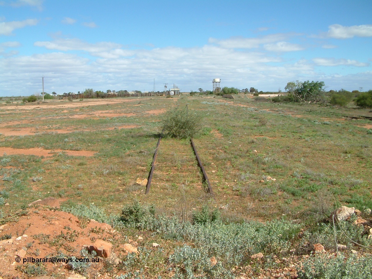 030415 141541
Kingoonya, located at the 426.5 km on the Trans Australian Railway, looking south with cattle yards and loading race, power station, standpipe and tanks stand all in the distance, loading ramp on the right. [url=https://goo.gl/maps/MeE2ay7UBV6jbHiR8]GeoData location[/url].
