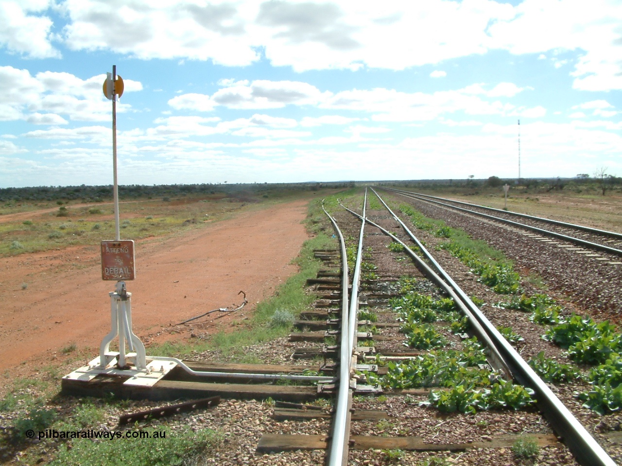 030415 150258
Ferguson, located at the 469 km on the Trans Australian Railway, looking west along the 1800 metre long crossing loop, siding point work on timber sleepers for goods siding with cattle race. [url=https://goo.gl/maps/XNaMGCNxZ4yv7Lrr9]GeoData location[/url].
