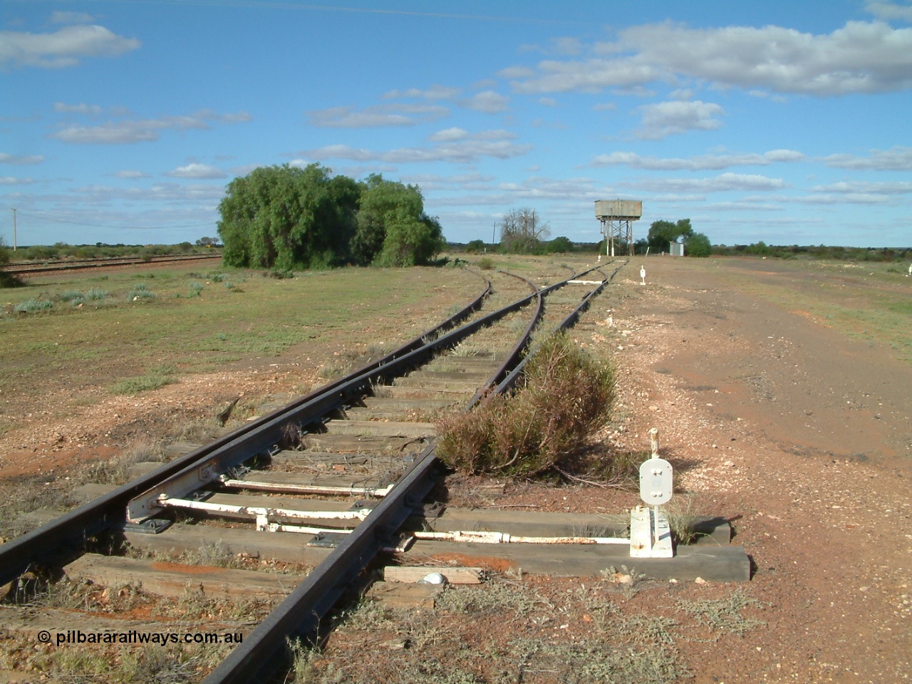 030415 154708
Tarcoola, at the 504.5 km, looking south east along the No. 1 Water Road, first set of points is the Camp Train Road, then the two Loco Roads No. 1 and No. 2. [url=https://goo.gl/maps/hBMd6tPiCPjG64URA]GeoData location[/url]. 15th April 2003.
