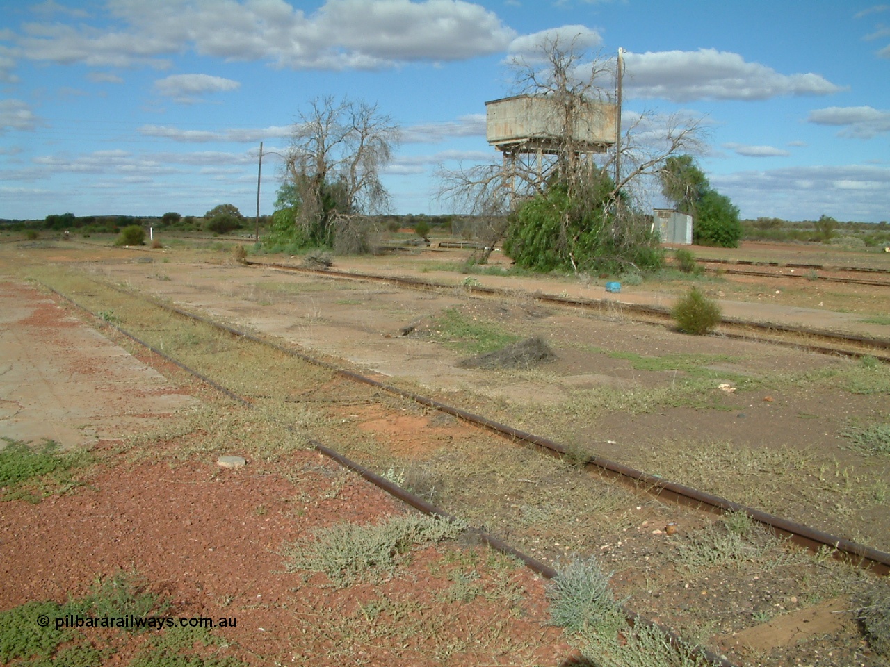 030415 154909
Tarcoola, at the 504.5 km, looking south east, roads are, Camp Train, No. 1 Loco, No. 2 Loco and No. 1 Water Road, mainline to the left. Water tank on stand. [url=https://goo.gl/maps/R5WaD6pqUgJG5abD9]GeoData location[/url]. 15th April 2003.
