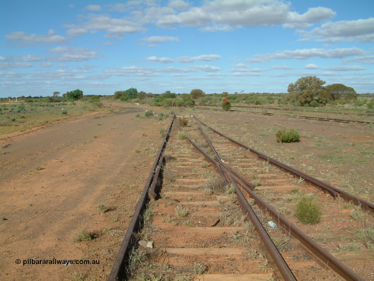 030415 155056
Tarcoola, at the 504.5 km, looking east, end of the Camp Train and No. 1 Loco roads at the points, while No. 2 Loco and No. 1 Water Road curve in from the right, mainline to the left. [url=https://goo.gl/maps/9wxzgiU7GAe9hPjz5]GeoData location[/url]. 15th April 2003.
