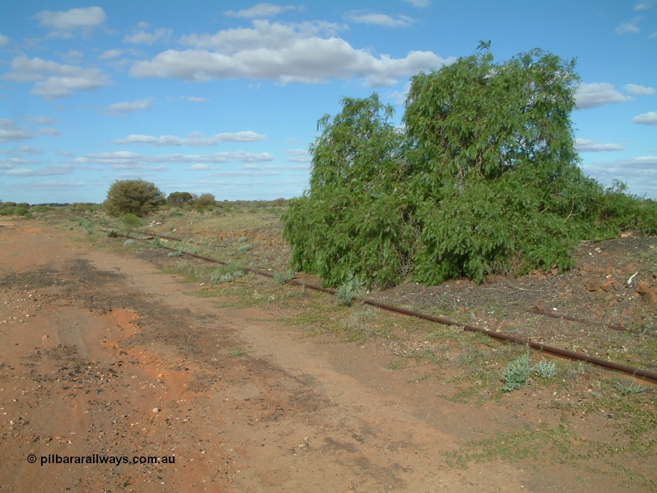 030415 155314
Tarcoola, at the 504.5 km, looking south east at the remains of the head shunt off the Camp Train and No. 1 Water Roads. [url=https://goo.gl/maps/1664sPzPxipPs6mZ6]GeoData location[/url]. 15th April 2003.
