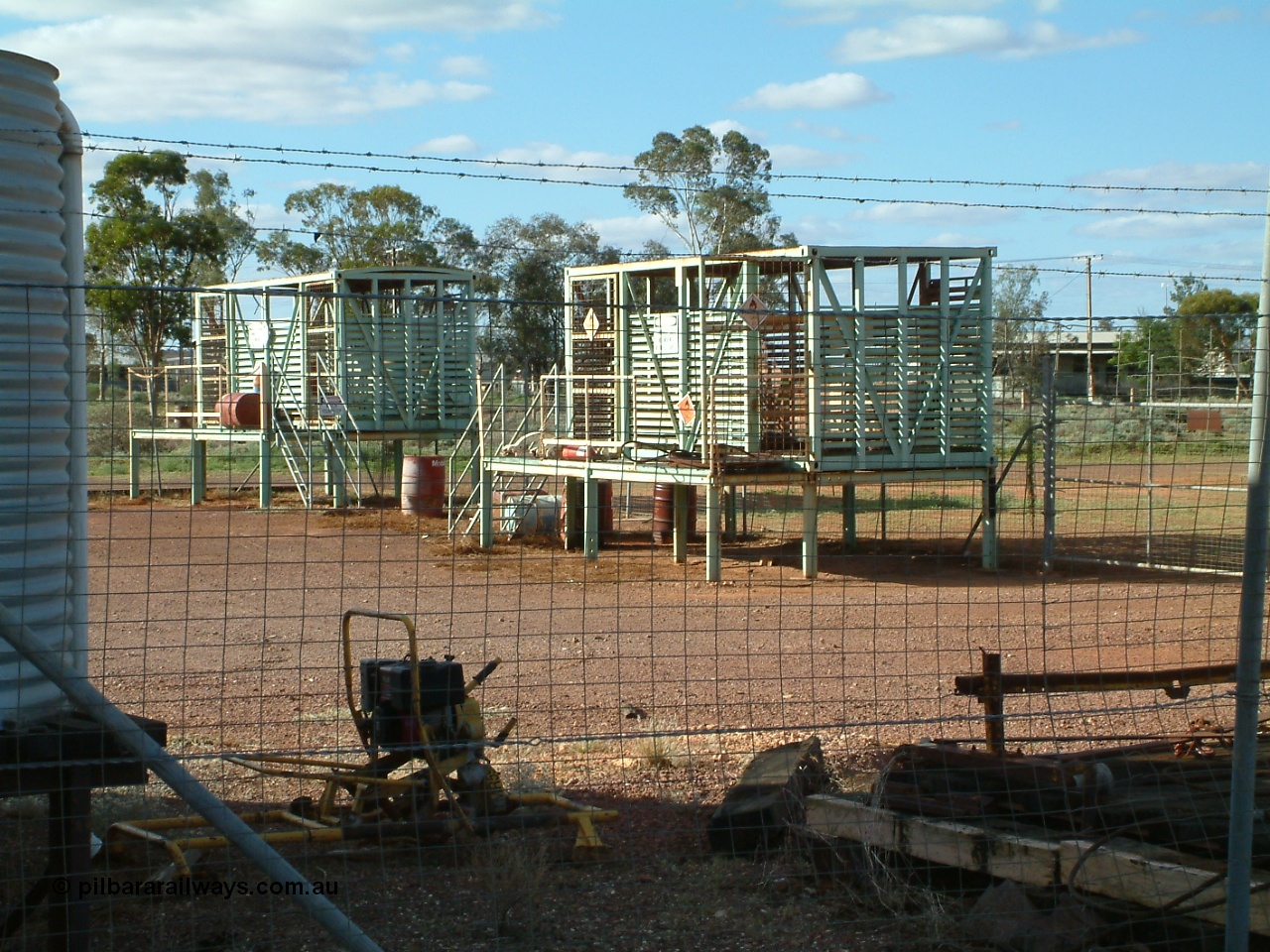 030415 155956
Tarcoola, at the 504.5 km, works compound see old livestock waggons converted to storage shed for gas bottles and the like. [url=https://goo.gl/maps/6oGe5dhUe3chHeB57]GeoData location[/url]. 15th April 2003.
