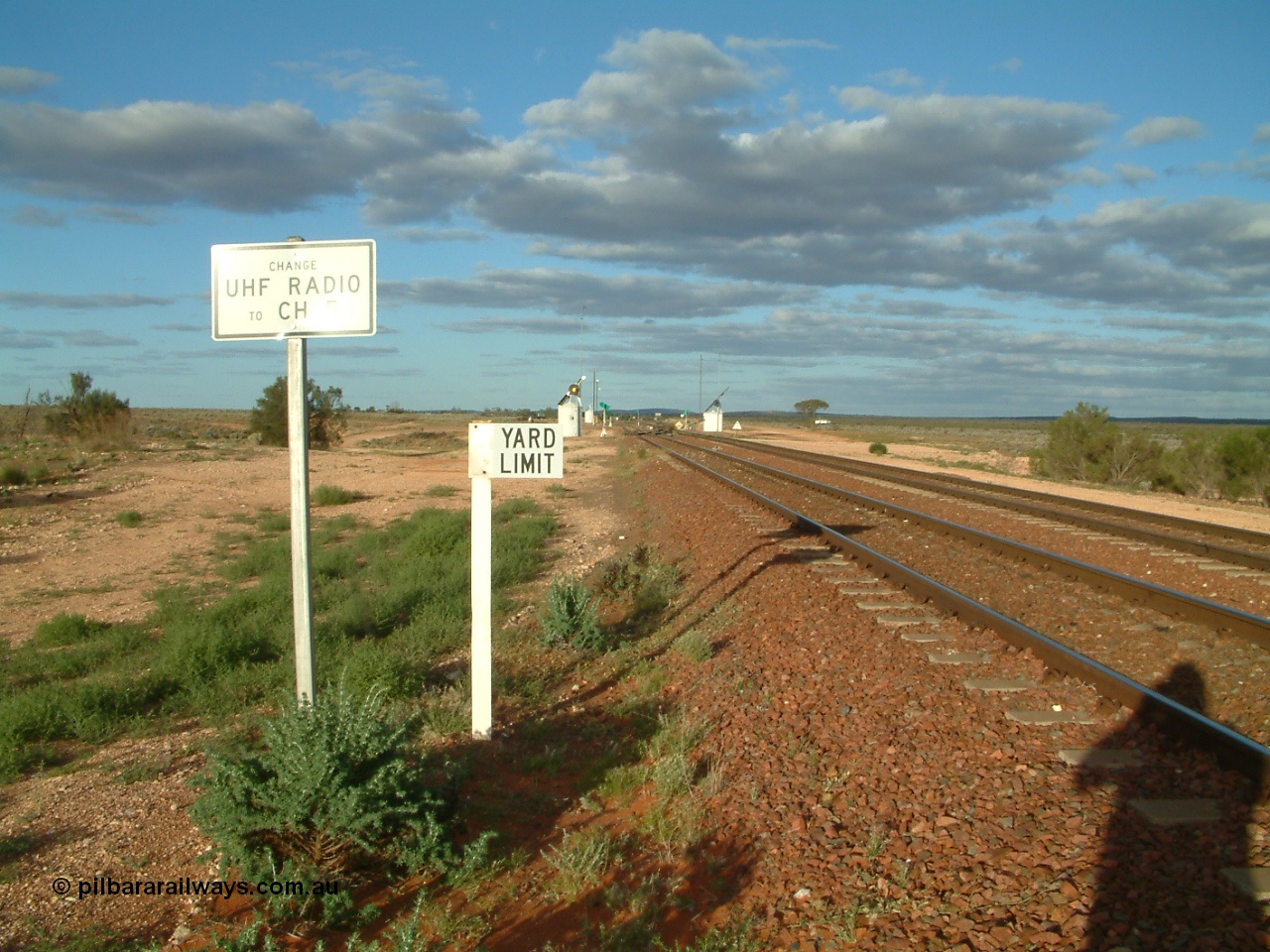 030415 171548
Tarcoola, at the 504.5 km, looking east along the Central Australian line at the western yard limit and radio channel change boards, Trans Australian line is on the right. Tarcoola is the junction for the TAR and CAR railways. [url=https://goo.gl/maps/vUPjQ7MxV2e9ndSY7]GeoData location[/url]. 15th April 2003.
