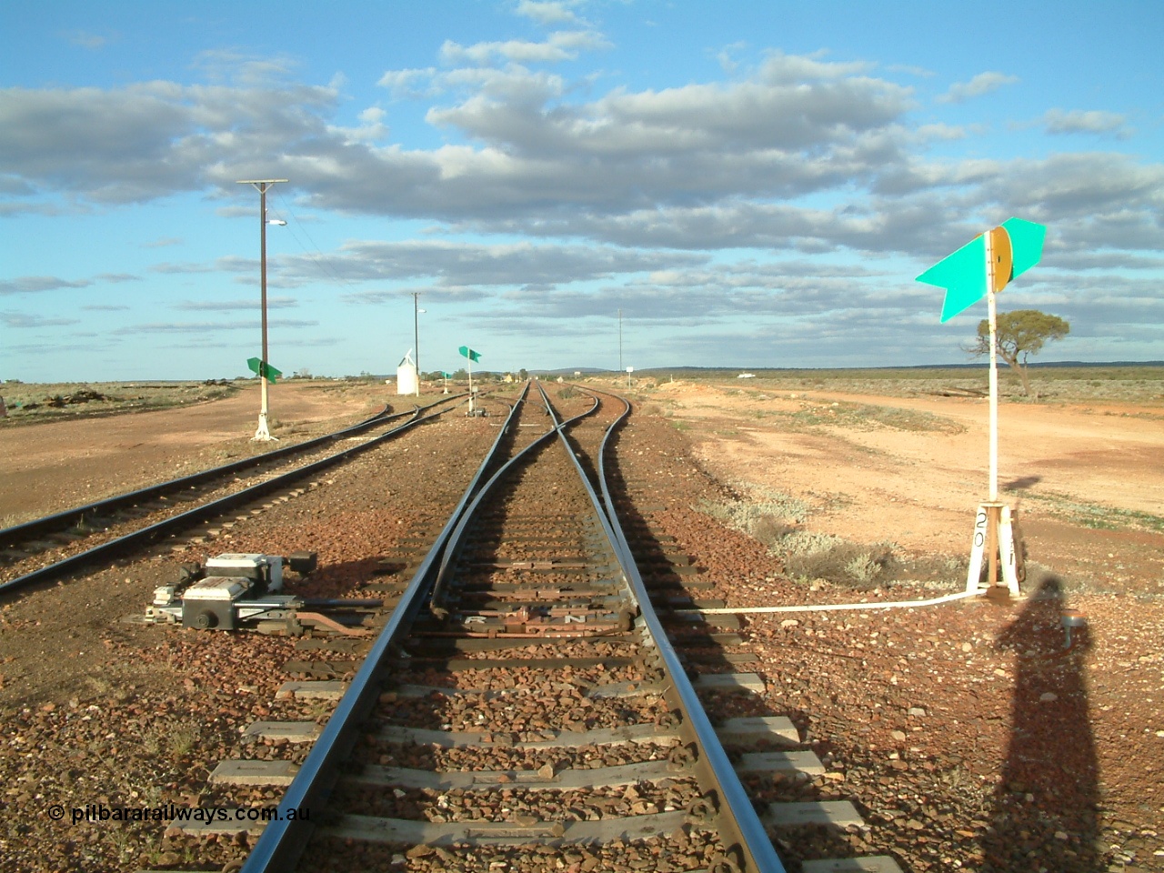 030415 171906
Tarcoola, at the 504.5 km, looking east along the Trans Australian line with the loop joining from the right and the Central Australian line on the left. Tarcoola is the junction for the TAR and CAR railways. [url=https://goo.gl/maps/qp85867GriDEnPyD7]GeoData location[/url]. 15th April 2003.
