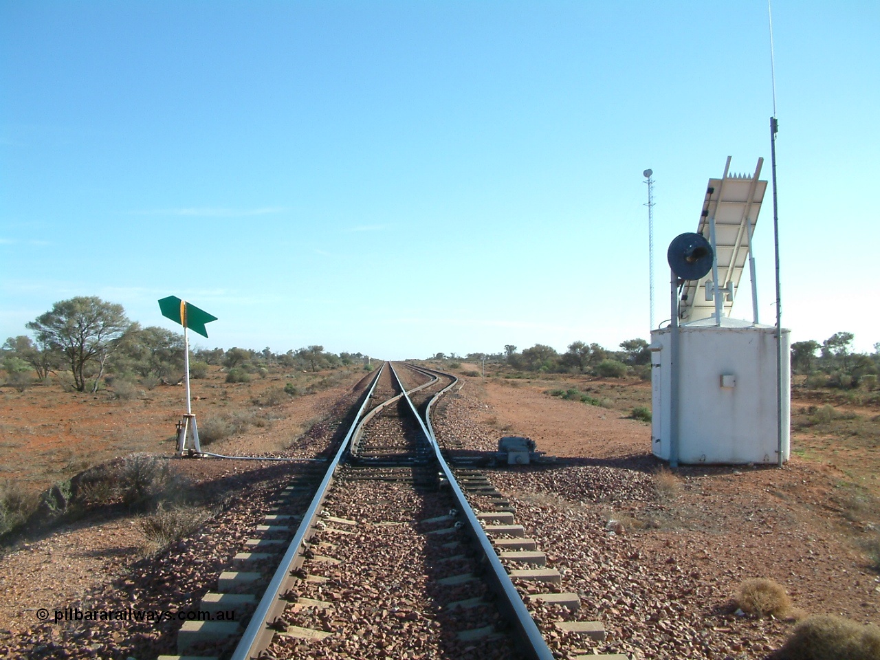 030416 083542
Carnes Siding located at the 566.4 km on the Central Australian line from Tarcoola to Alice Springs. View of the line and loop looking north from the south end with point indicator, interlocking hut and repeater signal and communications tower in the background. [url=https://goo.gl/maps/d5okP7KUhaCnCJaVA]GeoData location[/url]. 16th April 2003.
