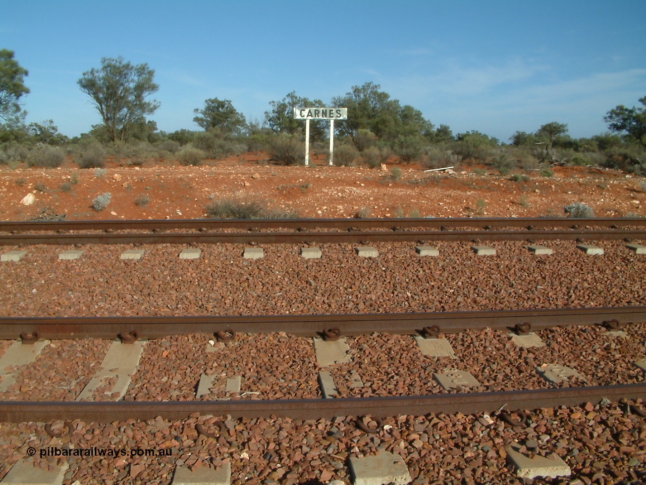 030416 084004
Carnes Siding located at the 566.4 km on the Central Australian line from Tarcoola to Alice Springs. Station nameboard. [url=https://goo.gl/maps/4PBoUfKbtJfCwKLA9]GeoData location[/url]. 16th April 2003.
