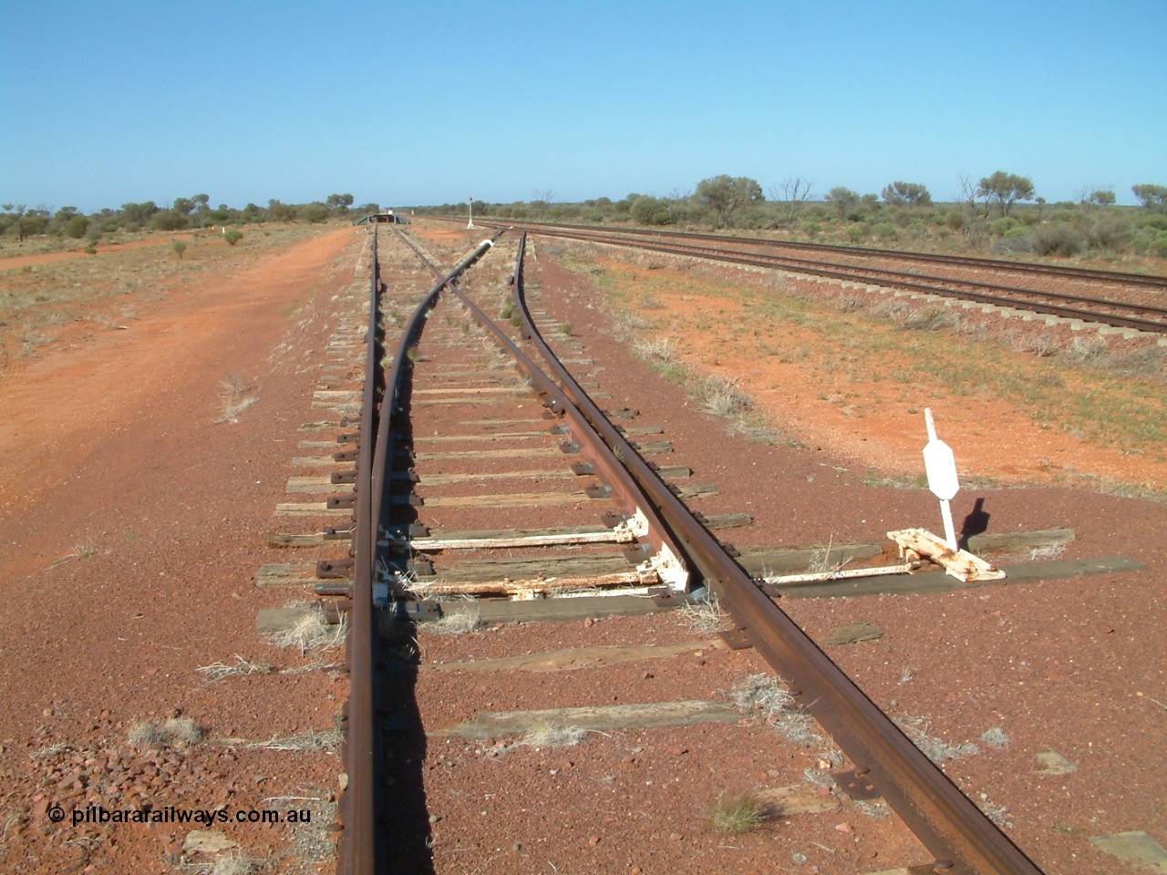 030416 094958
Wirrida Siding, looking south towards Tarcoola with the goods loop returning to the loop and the loading ramp and siding points. Located at the 641 km from the 0 datum at Coonamia and 137 km north of Tarcoola between Carnes and Manguri on the Tarcoola - Alice Springs line. [url=https://goo.gl/maps/CNUy7icETwEEQPgq7]GeoData location[/url]. 16th April 2003.
