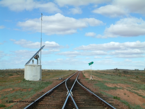 030415 150040
Ferguson, located at the 469 km on the Trans Australian Railway, looking east at the east end of the 1800 metre long crossing loop, point work on timber sleepers, interlocking hut with dual control point machine, indicator and lever on the right. [url=https://goo.gl/maps/XNaMGCNxZ4yv7Lrr9]GeoData location[/url].
