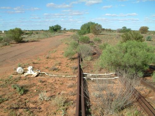 030415 155228
Tarcoola, at the 504.5 km, looking east, points for Camp Train and No. 2 Loco Roads with the No. 1 Water Road coming in from the right. Mainline to the left. [url=https://goo.gl/maps/y17pUsTYVeRwPsa67]GeoData location[/url]. 15th April 2003.
