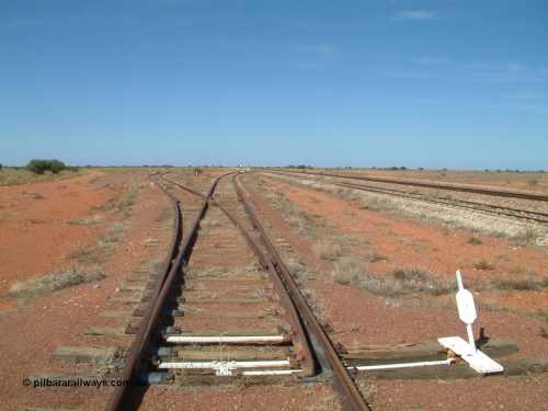 030416 105908
Manguri Siding, looking south at the end of the goods loop with a loading ramp dead-end siding off to the left. Located 706.5 km from the 0 datum at Coonamia and 200 km north of Tarcoola between Wirrida and Cadney Park on the Tarcoola - Alice Springs line. [url=https://goo.gl/maps/Nohh3U8BSTposHKV9]GeoData location[/url]. 1April 6, 2003.
