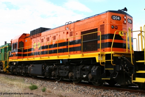 060108 2065
Lock, ARG 1200 class unit 1204, a Clyde Engineering EMD model G12C serial 65-428, final of fourteen originally built between 1960-65 for WAGR as their A class A 1514, fitted with dynamic brakes and financed by Western Mining Corporation, started on the Eyre Peninsula in August 2004.
Keywords: 1200-class;1204;Clyde-Engineering-Granville-NSW;EMD;G12C;65-428;A-class;A1514;