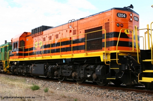 060108 2066
Lock, ARG 1200 class unit 1204, a Clyde Engineering EMD model G12C serial 65-428, final of fourteen originally built between 1960-65 for WAGR as their A class A 1514, fitted with dynamic brakes and financed by Western Mining Corporation, started on the Eyre Peninsula in August 2004.
Keywords: 1200-class;1204;Clyde-Engineering-Granville-NSW;EMD;G12C;65-428;A-class;A1514;