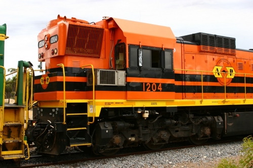 060108 2076
Lock, ARG 1200 class unit 1204, a Clyde Engineering EMD model G12C serial 65-428, final of fourteen originally built between 1960-65 for WAGR as their A class A 1514, fitted with dynamic brakes and financed by Western Mining Corporation, started on the Eyre Peninsula in August 2004. Shows dynamic brake grid arrangement and cab air conditioner unit.
Keywords: 1200-class;1204;Clyde-Engineering-Granville-NSW;EMD;G12C;65-428;A-class;A1514;