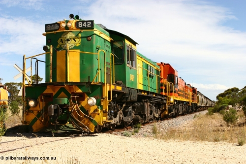 060109 2100
Kyancutta, Kyancutta Tanks Rd grade crossing, ASR 830 class unit 842, an AE Goodwin built ALCo DL531 model loco serial 84140 leads EMD unit 1204 due to air-conditioning trouble and sister ALCo 851 as the empty north bound grain train pauses for a crew change. 9th January 2006.
Keywords: 830-class;842;AE-Goodwin;ALCo;DL531;84140;