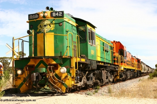 060109 2101
Kyancutta, Kyancutta Tanks Rd grade crossing, ASR 830 class unit 842, an AE Goodwin built ALCo DL531 model loco serial 84140 leads EMD unit 1204 due to air-conditioning trouble and sister ALCo 851 as the empty north bound grain train pauses for a crew change. 9th January 2006.
Keywords: 830-class;842;AE-Goodwin;ALCo;DL531;84140;