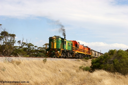 060109 2105
Kyancutta, Kyancutta Tanks Rd grade crossing, ASR 830 class unit 842, an AE Goodwin built ALCo DL531 model loco serial 84140 leads EMD unit 1204 due to air-conditioning trouble and sister ALCo 851 lift the empty north bound grain train away from crew change. 9th January 2006.
Keywords: 830-class;842;AE-Goodwin;ALCo;DL531;84140;