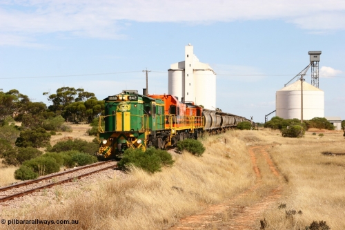 060109 2113
Kyancutta, ASR 830 class unit 842, an AE Goodwin built ALCo DL531 model loco serial 84140 leads EMD unit 1204 due to air-conditioning trouble and sister ALCo 851 as they shunt across Museum Terrace to place empty grain waggons on the silo loop. 9th January 2006.
Keywords: 830-class;842;AE-Goodwin;ALCo;DL531;84140;