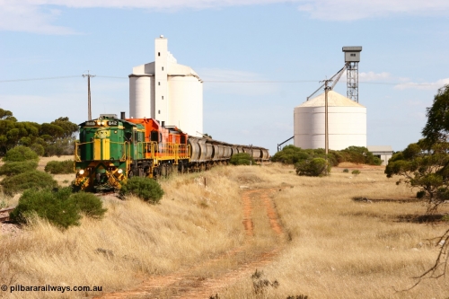 060109 2118
Kyancutta, ASR 830 class unit 842, an AE Goodwin built ALCo DL531 model loco serial 84140 leads EMD unit 1204 due to air-conditioning trouble and sister ALCo 851 as they shunt across Museum Terrace to place empty grain waggons on the silo loop. 9th January 2006.
Keywords: 830-class;842;AE-Goodwin;ALCo;DL531;84140;