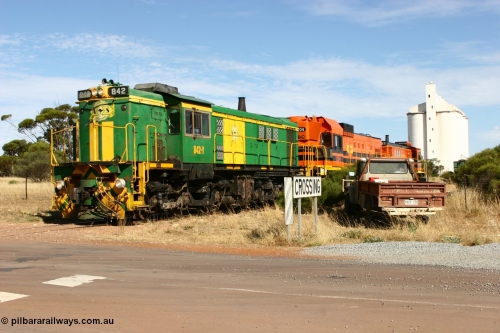 060109 2130
Kyancutta, ASR 830 class unit 842, an AE Goodwin built ALCo DL531 model loco serial 84140 leads EMD unit 1204 due to air-conditioning trouble and sister ALCo 851 as they shunt across Museum Terrace to re-join the train on the mainline. 9th January 2006.
Keywords: 830-class;842;AE-Goodwin;ALCo;DL531;84140;