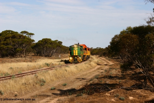 060109 2137
Wannamana, [url=https://goo.gl/maps/43EOs]on the curve[/url] 2 km north of the former station site empty train lead by ASR 830 class unit 842, an AE Goodwin built ALCo DL531 model loco serial 84140 with an EMD 1200 class and a sister ALCo unit. 9th January 2006.
Keywords: 830-class;842;AE-Goodwin;ALCo;DL531;84140;