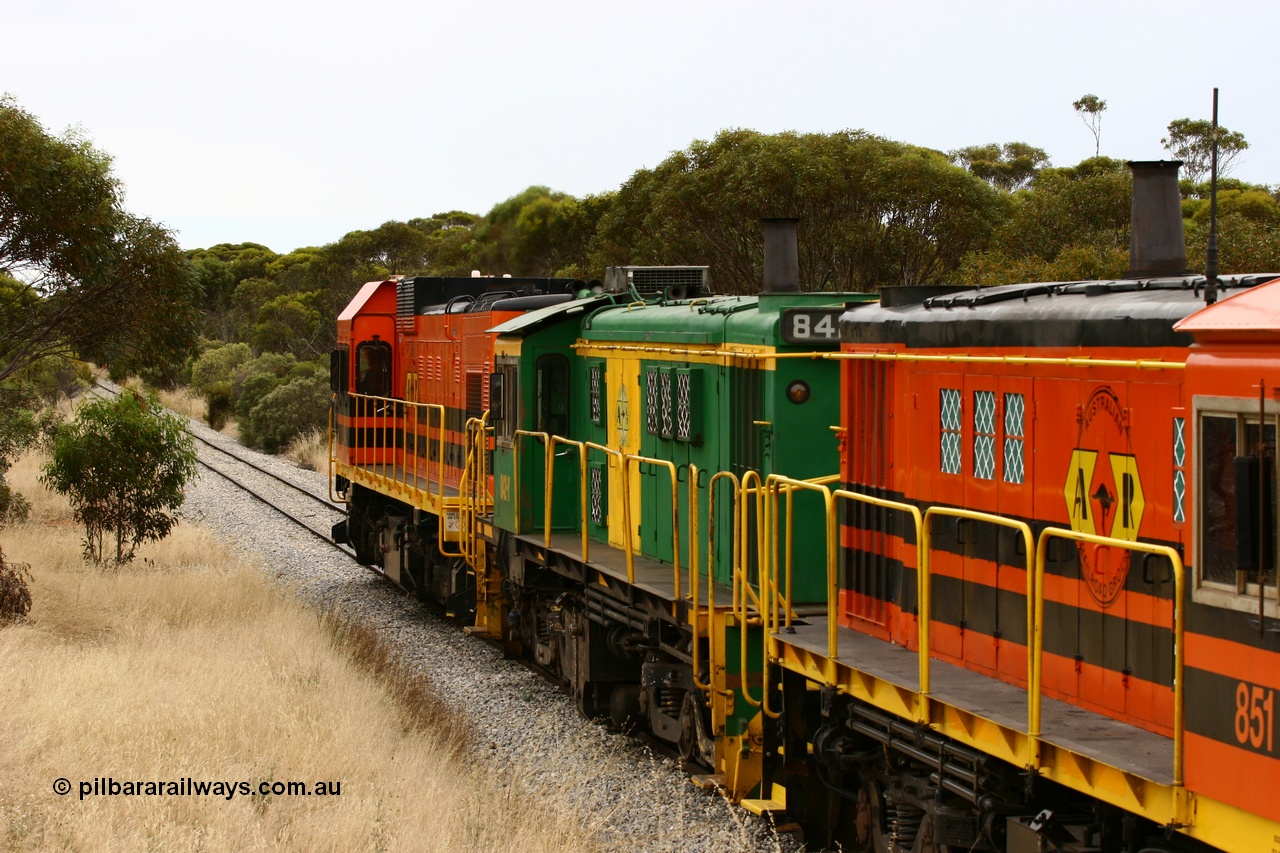 060110 2216
On the curve near the 85 km between Yeelanna and Karkoo, trailing view of 830 class AE Goodwin built ALCo model DL531 unit 842 serial 84140, ex SAR broad gauge and to Eyre Peninsula in October 1987, and ARG 1200 class unit 1204, a Clyde Engineering EMD model G12C serial 65-428, originally built for the WAGR as the final unit of fourteen A class locomotives in 1965 and sent to the Eyre Peninsula in July 2004 leads an empty grain train. [url=https://goo.gl/maps/7kwfXBE6nS12]Approx. location of image[/url].
Keywords: 1200-class;1204;Clyde-Engineering-Granville-NSW;EMD;G12C;65-428;A-class;A1514;830-class;842;AE-Goodwin;ALCo;DL531;84137;